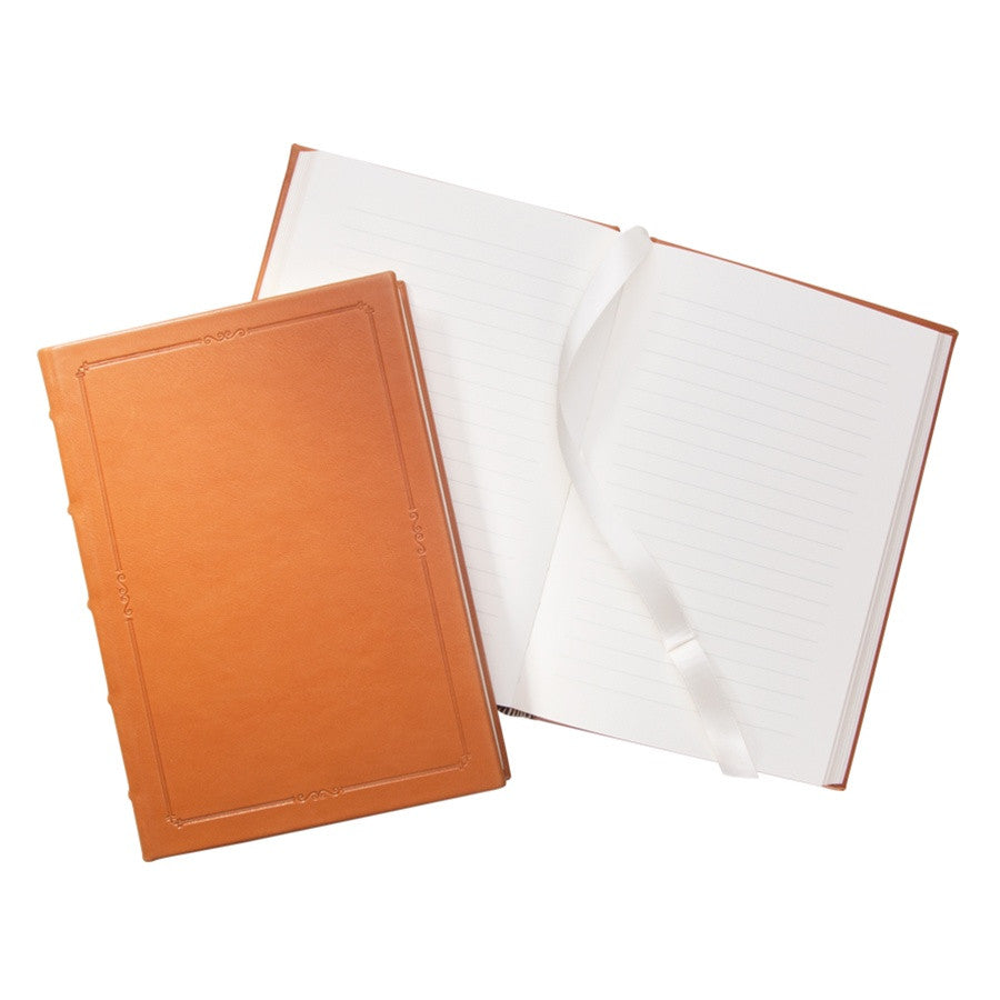 small hardcover leather journal with lined pages